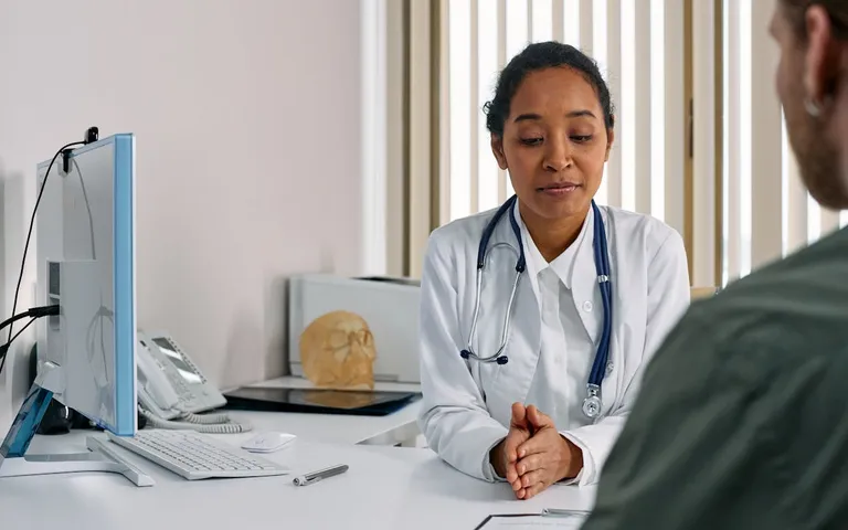 Doctor consulting with a patient in a modern medical office